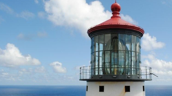 Lighthouse over the sea, in the public domain from http://coastguard.dodlive.mil/2016/02/legacy-of-light-worlds-largest-lens-shines-aloha-light/.