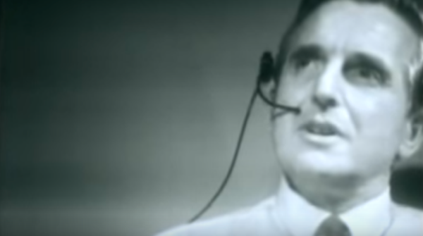 A black and white screengrab from the recording of Douglas Engelbart giving the "Mother of All Demos" in 1968.