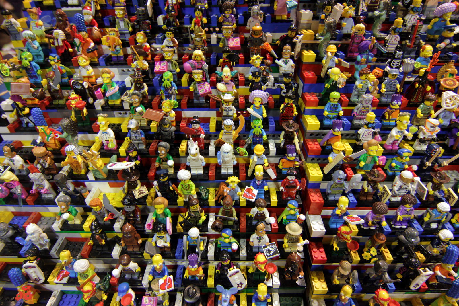 A lot of Lego people sitting in Lego bleachers.